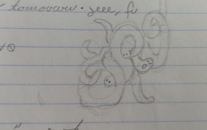 progress sketch 2: some of the pencil swirls have been resolved into 3 or more worms in a tangle. 3 cartoon faces can be seen, and the worms' bodies have been lightly penciled-in